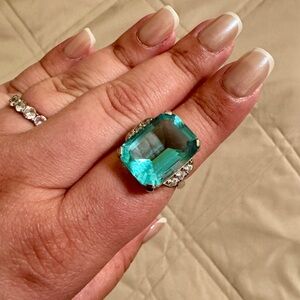Vintage-style statement cocktail ring with a large emerald cut aquamarine